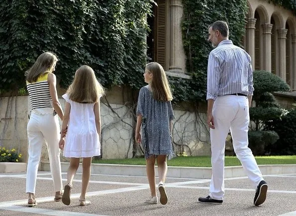 King Felipe, Queen Letizia and their daugthers Princess Leonor and Infanta Sofía on holiday in Palma de Mallorca. Letizia wore line blouse, style