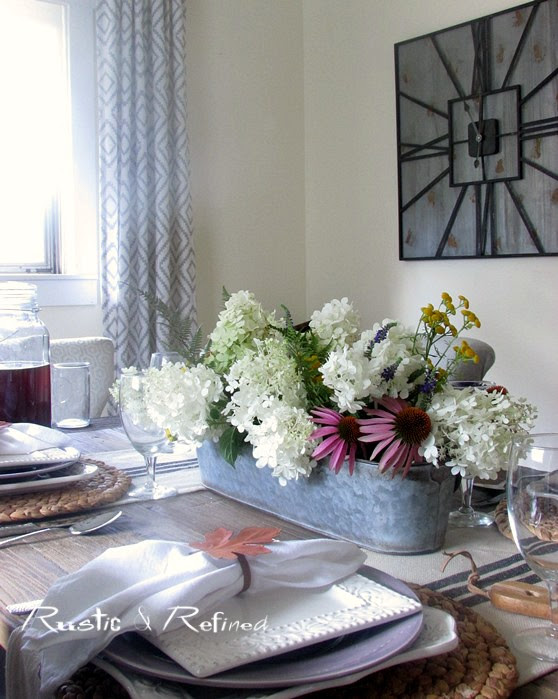A quick and easy table set for family and friends using fresh cut flowers for a pretty farmhouse tablescape.