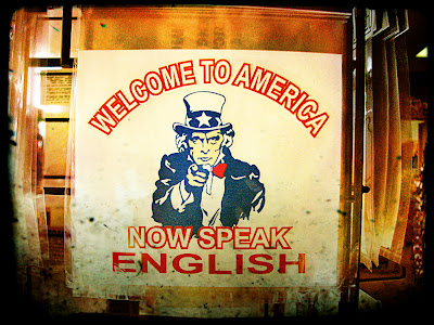 Poster: 'Welcome to America - Now speak English'