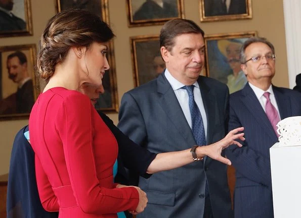 Queen Letizia wore Carolina Herrera red dress, carried Felipe Varela clutch bag. Queen visited the Spanish Royal Academy in Rome