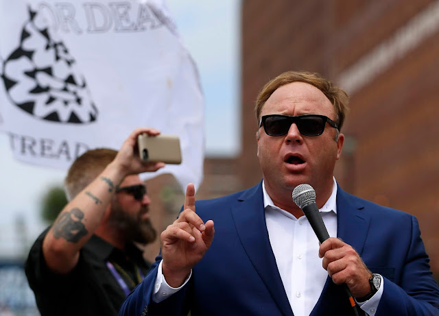 Alex Jones speaks during a rally for candidate Donald Trump near the Republican National Convention in July 2016