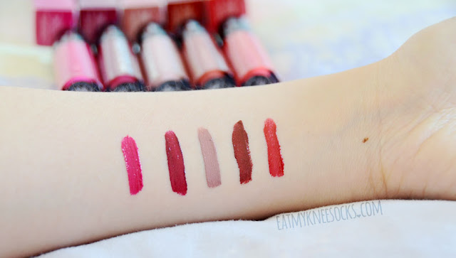 Details on the True Whipped Stain Gloss liquid lip glosses from Studio Gear Cosmetics, available in pebble, fuschia, red, burgundy, and wine.