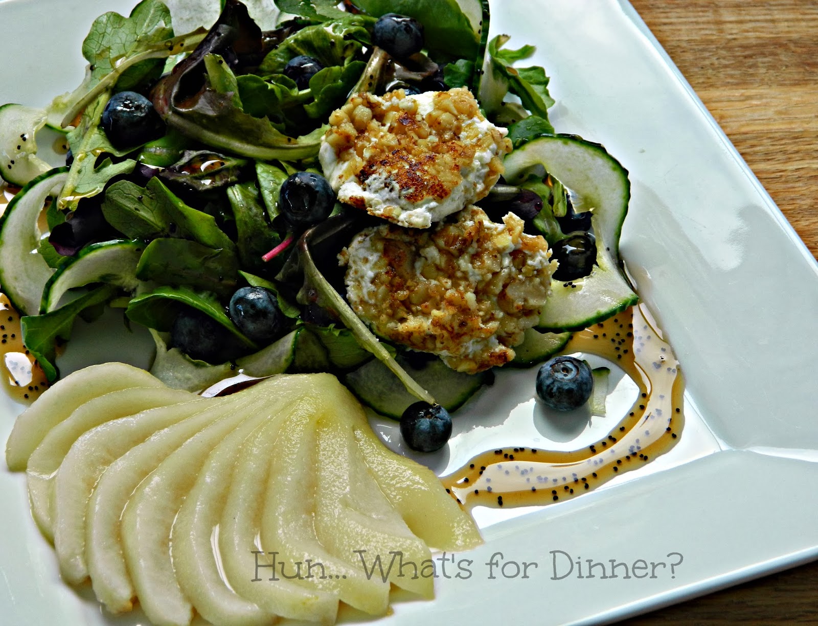 Hun... What's for Dinner?: Mixed greens paired with a maple poached pear, blueberries, walnut crusted goat cheese and drizzled with a maple poppy seed dressing.