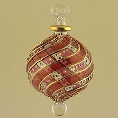 It was a blown glass ornament, claret red and clear glass, fragile and graceful.