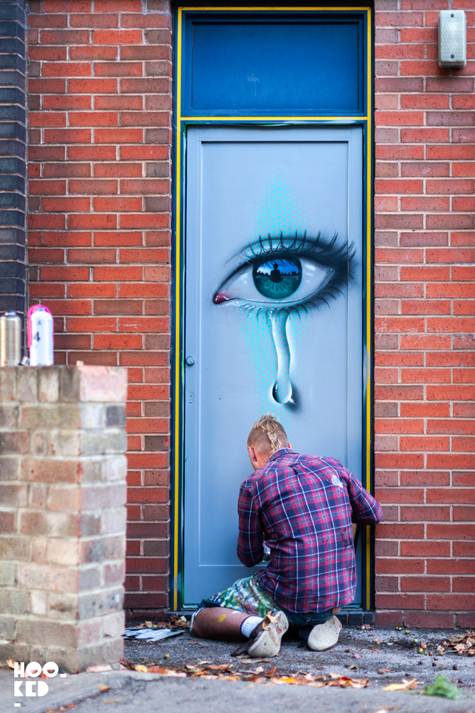 Street Artist My Dog SIghs at work in Cheltenham, UK for the Cheltenham Paint Festival
