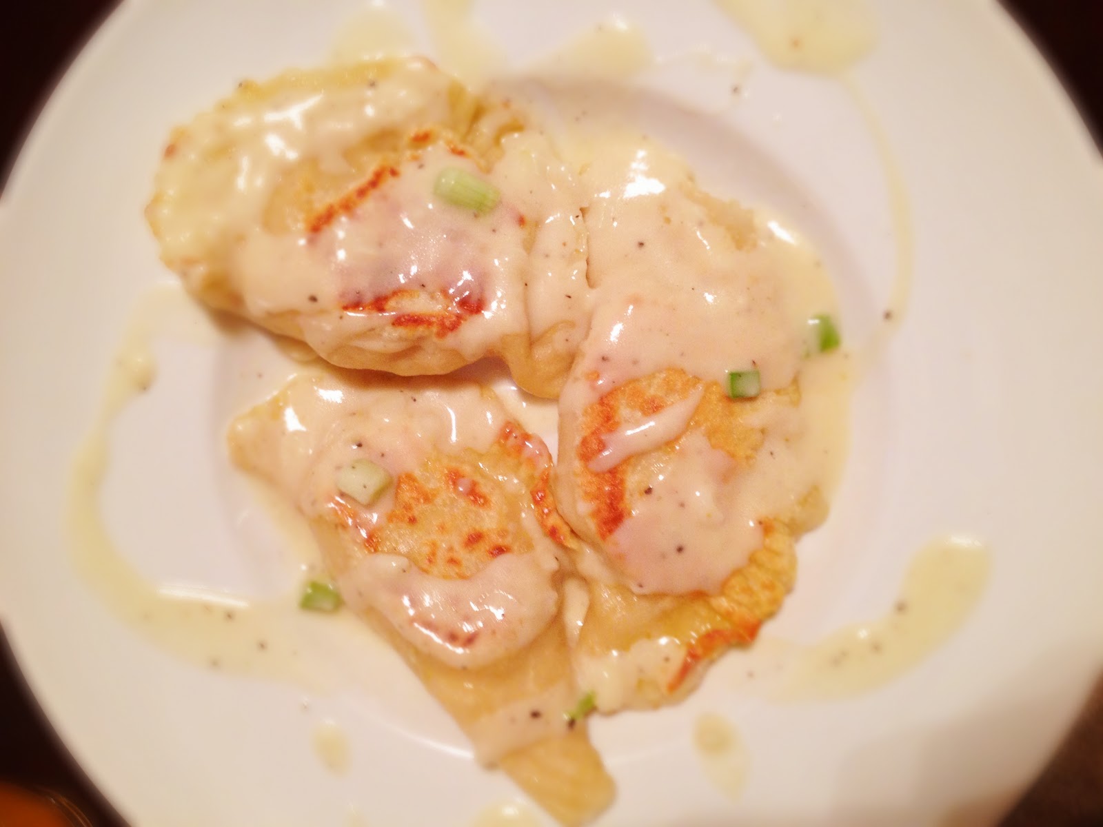 Potato and Cheese Pierogi with Sour Cream GarlicChive Sauce