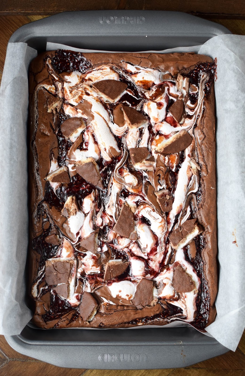 Chocolate brownie swirled with marshmallow fluff, raspberry jam and studded with chunks of jammy waggon wheel.