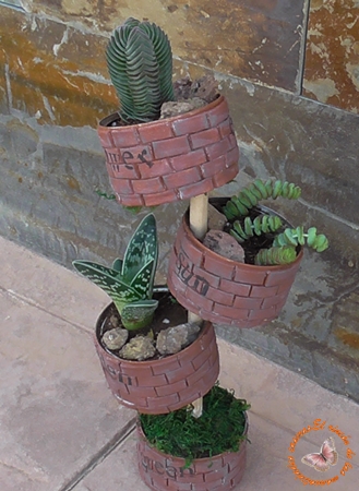 El rincón de las manualidades caseras.: Mini jardín con latas recicladas.