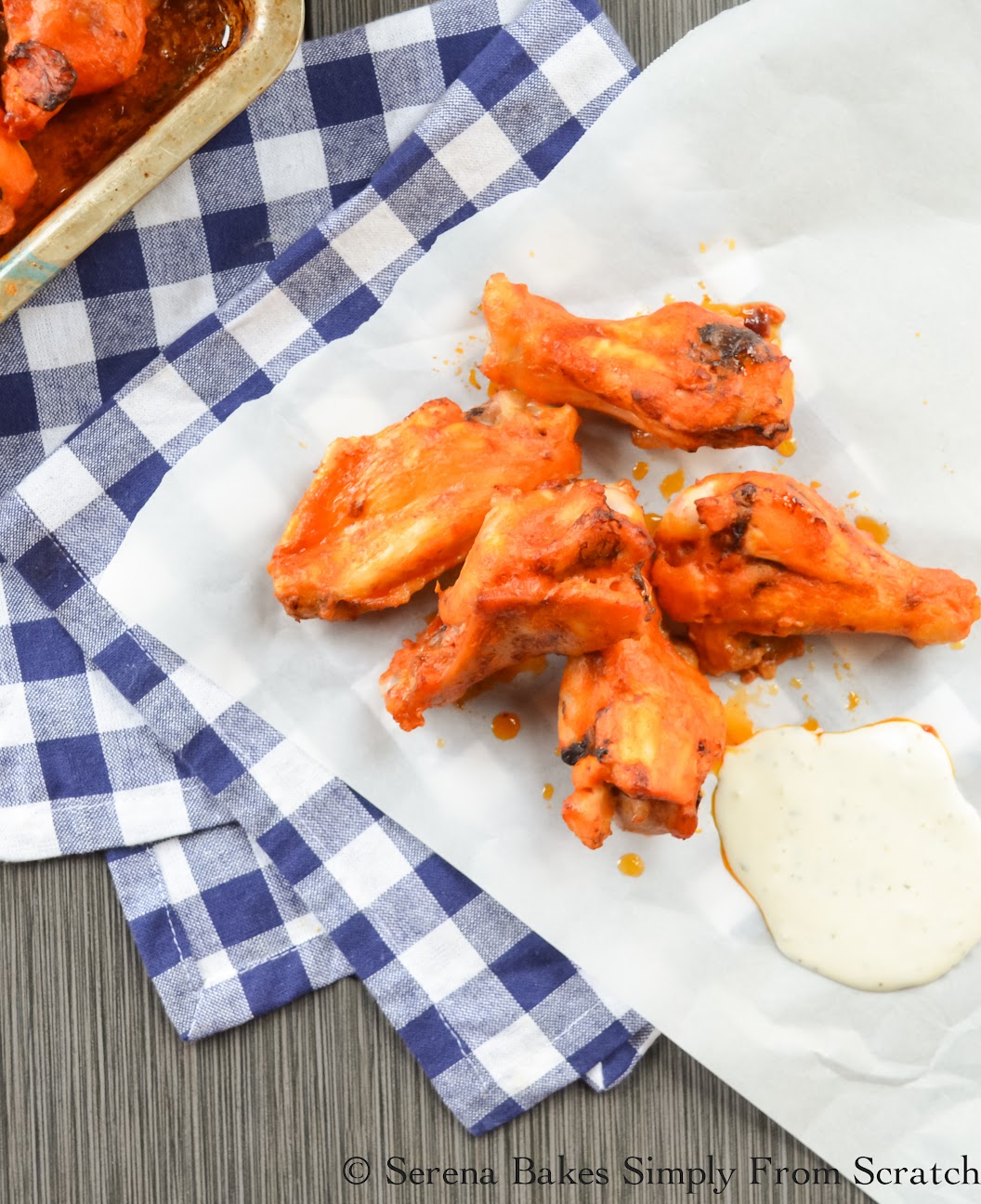 Baked Chicken Hot Wings are simple to make with a crispy on the outside, but juicy on the inside. A favorite recipe for Super Bowl from Serena Bakes Simply From Scratch.