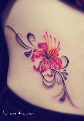 red flower hip tattoo with totem type of stem