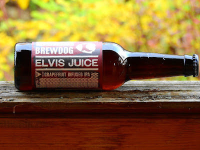 Bottle of Brewdog Elvis Juice on an autumn porch