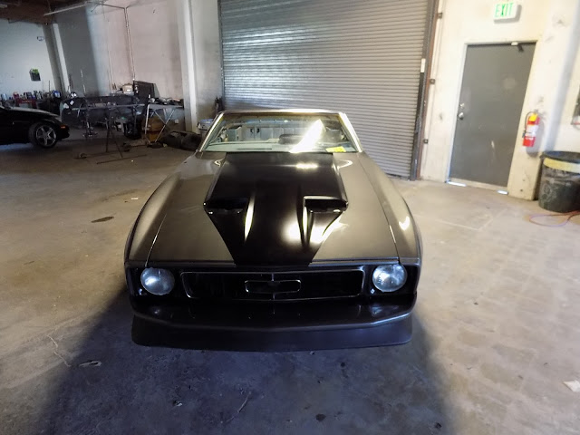 1973 Mustang with new front end & customer's classic paint scheme.