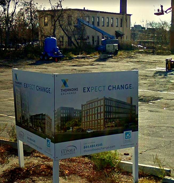 Sign in C.I. Hood's parking lot announcing renovation of building, courtesy Google Street View