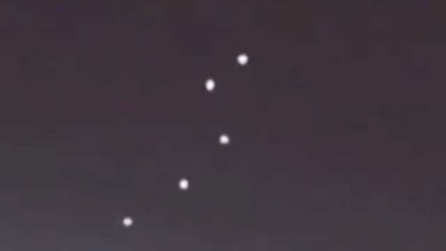 Mothership-UFO-with-a-smaller-fleet-of-UFOs-in-formation-above-it-over-Brazil.