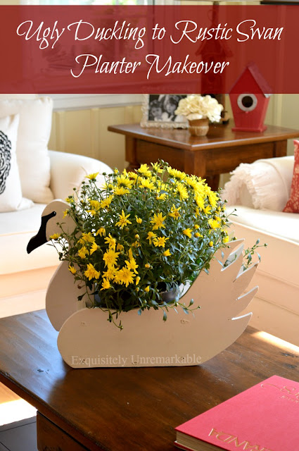 Ugly Duck To Rustic Swan Planter text over photo of wooden swan filled with yellow flowers in living room