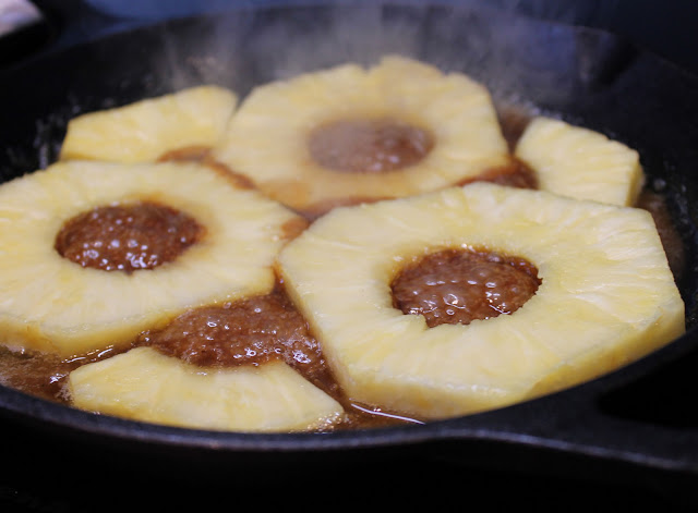 Cook the pineapple in a caramel sauce made from brown sugar and butter. Pineapple cooking in Caramel Sauce