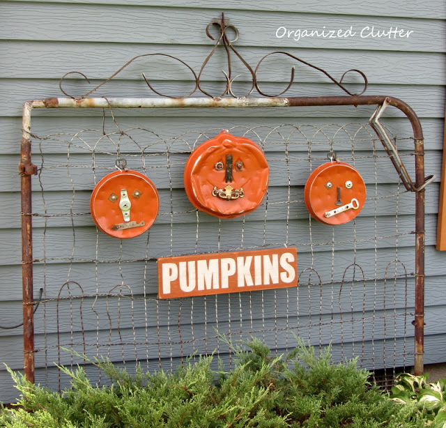 Trio of Junk Pumpkins on a Rusty Gate