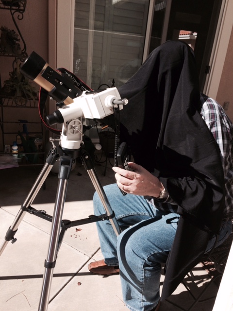 Resident Astronomer under the hood of hydrogen alpha scope (Source: Palmia Observatory)