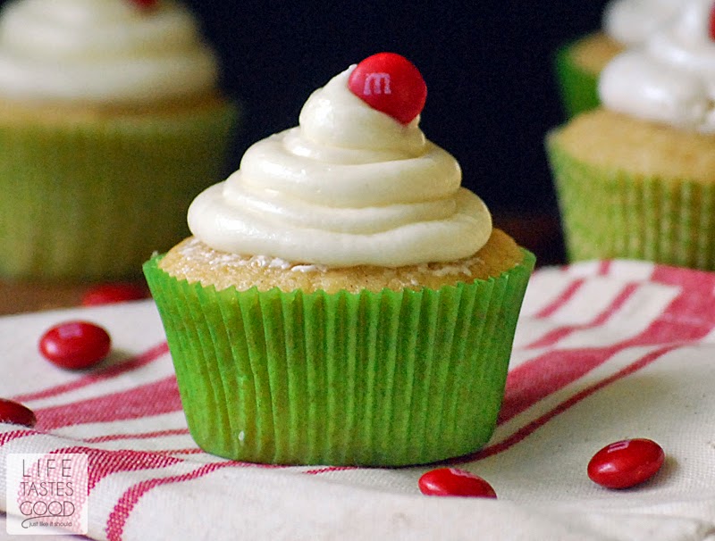 Applesauce Cupcakes with a meringue frosting and a single M&M on top are ready to eat