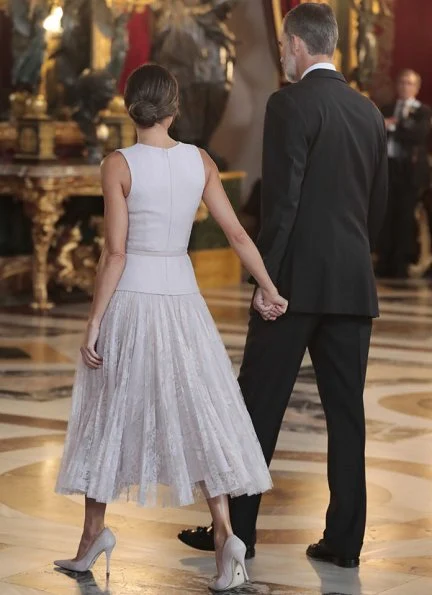 Queen Letizia wore Felipe Varela coat and dress. Crown Princess Leonor and Infanta Sofia attended National Day 2018 parade held at Plaza de Lima