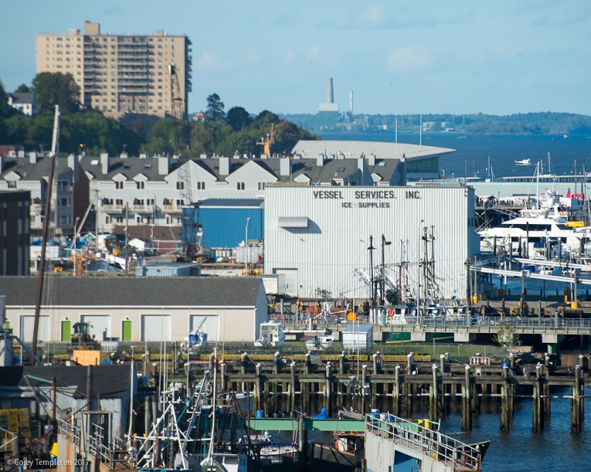 Portland, Maine May 2017 photo by Corey Templeton. Look Eastward, over the wharves of Portland Harbor. The chimney in the distance is the Wyman Station power plant in Yarmouth.