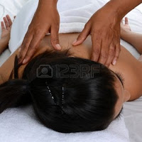 Therapist giving a  massage at JICM Wellness Center