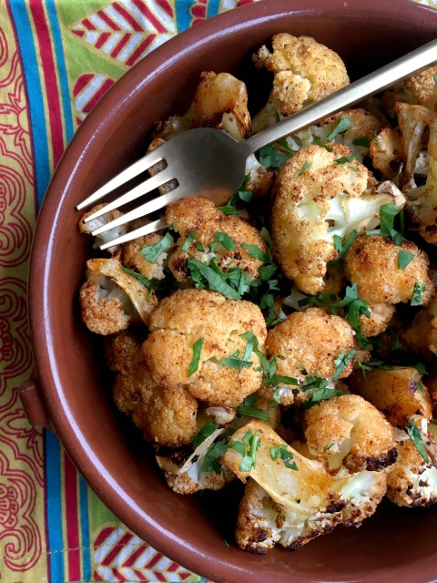 Spice roasted cauliflower is slightly sweet and mildly spiced with both hot and smoked paprika and a hint of cinnamon. Tossing it with olive oil and melted butter before roasting adds a richness to the flavour, turning sometime ho-hum cauliflower into an extra tasty side dish. 