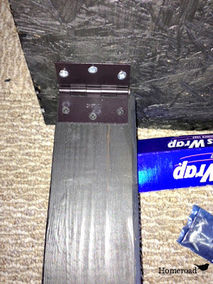underside of the desk with hinged leg