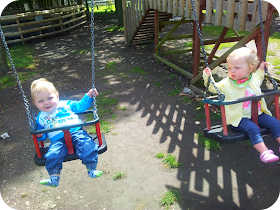 babies on swings, wingham wildlife park, blonde boy and girl