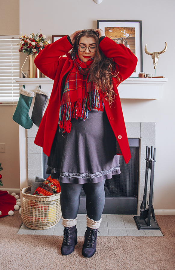 Red coat, red plaid scarf, black knit sweater, black skater skirt, black tights, cream high socks, black boots
