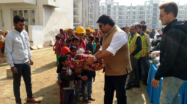 Mr Arman Chaudhary,Chief of HR,Emaar India at the Clothes Distribution Drive for labourers at Palm Terraces Gurugram 01 Mr Arman Chaudhary,Chief of HR,Emaar India at the Clothes Distribution Drive for labourers at Palm Terraces Gurugram 01