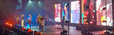 Christian music band on stage performing at a concert