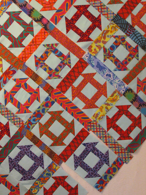 Churn Dash quilt block with Brandon Mabley fabric