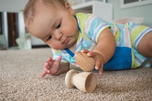 A look at the egg and cup, a classic Montessori baby toy. This beautiful, simple toy is a perfect fine motor toy for babies. 