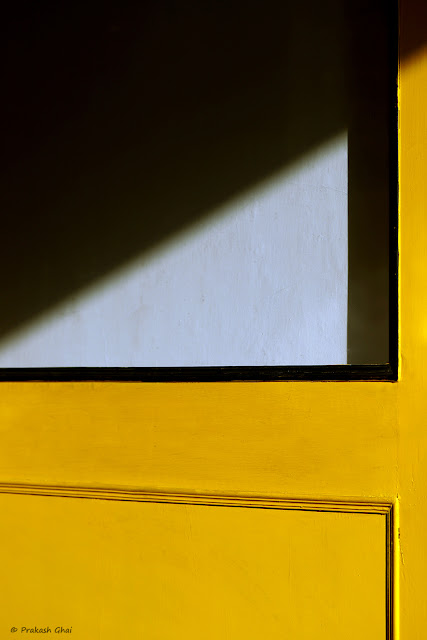 Two Minimal Art Photographs shot inside Cafe Step Out Jaipur in response to a Minimalism Challenge thrown by a Friend. Common Subject being the Yellow Door for Both Photographs.