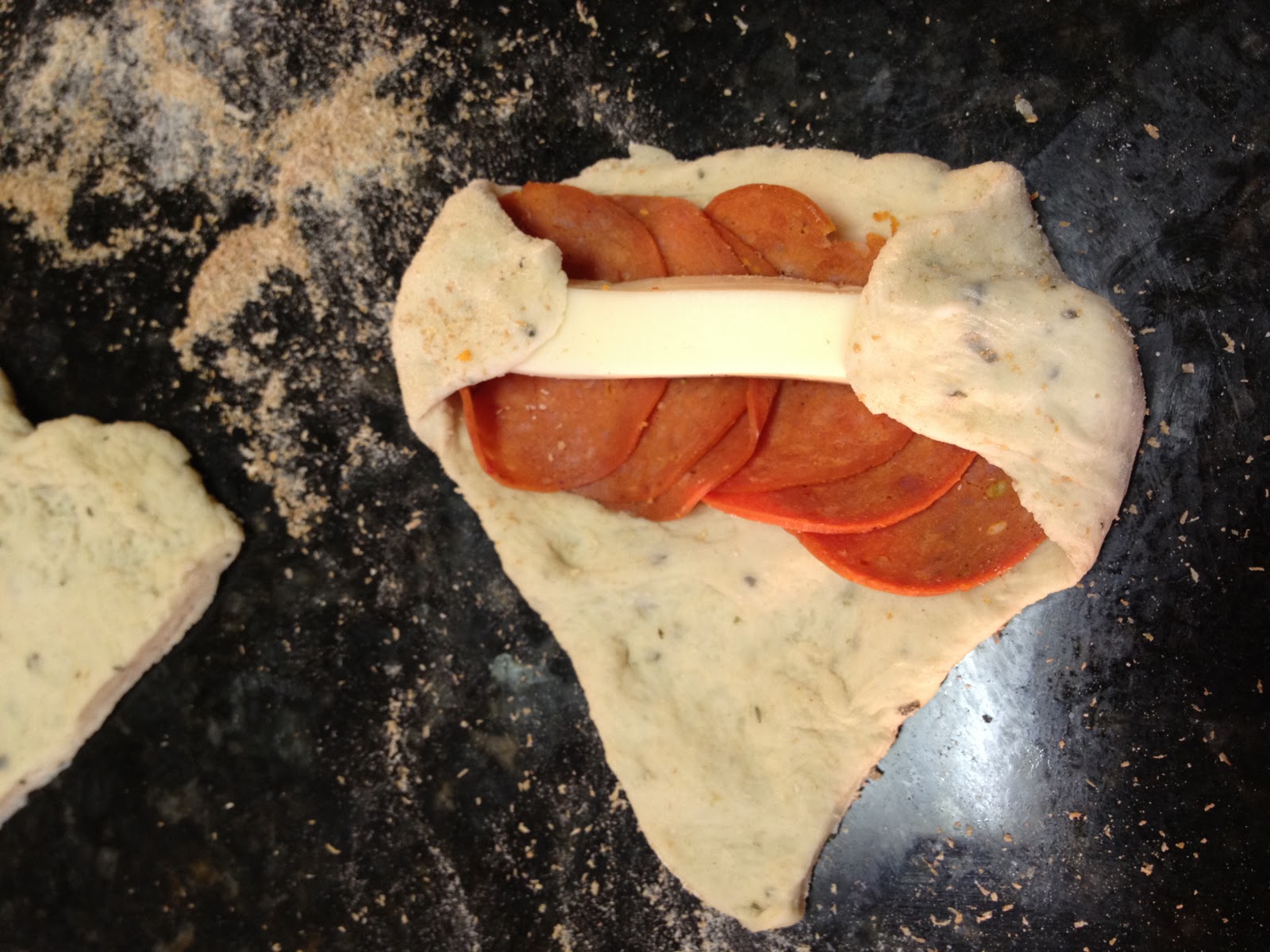 Making homemade pizza rolls