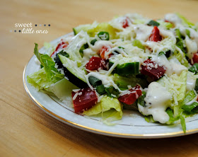 Simple Summer Caesar Salad: romaine lettuce, red peppers, cucumber, green onions, Parmesan cheese, and Caesar salad dressing.  Perfect, easy, delicious.  - www.sweetlittleonesblog.com