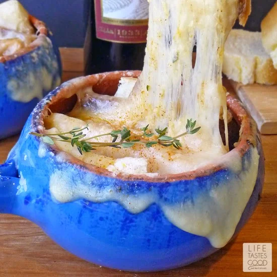 Cheesy French Onion Soup | by Life Tastes Good is a delicious blend of caramelized onions, herbs, toasted garlic bread, and lots of melty cheese. #SundaySupper #ComfortFood