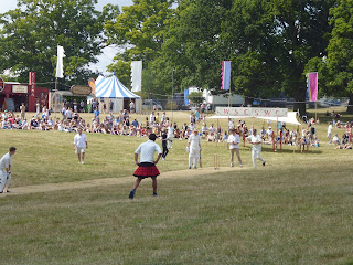 player in kilt at a cricket match british summer festival