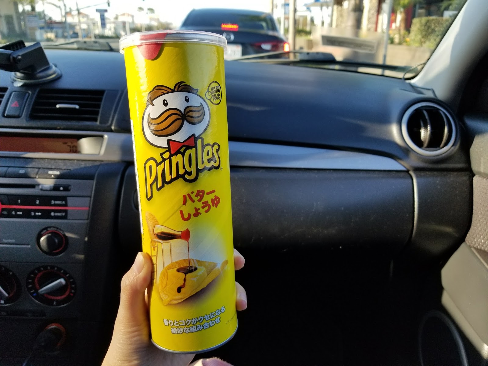 Munching on Japanese Pringles Butter Soy Sauce Chips!