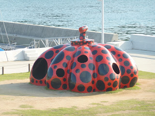 Another one of Naoshima's pumpkins, this one is larger, flatter and red with black spots. It's about as high as two people and has holes you can climb in. It's located in a grassy area near Miyanoura port