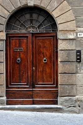 Wooden Doors in Montepulciano, Italy - Photo by Taste As You Go