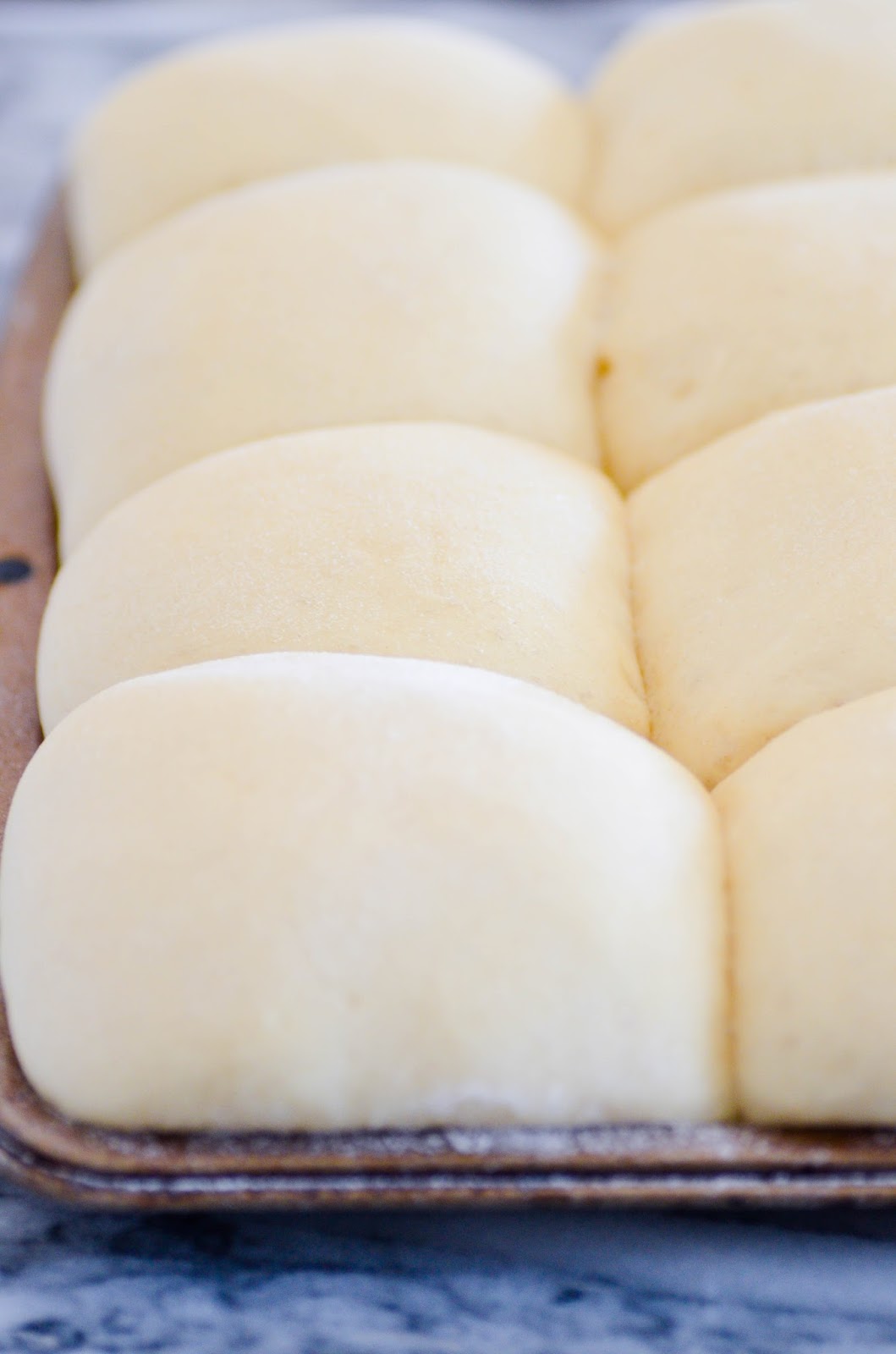 These dinner rolls were perfectly golden on top and pillow soft in the middle. Plus, this recipe makes a BIG batch, which I think is a must in a dinner roll recipe!