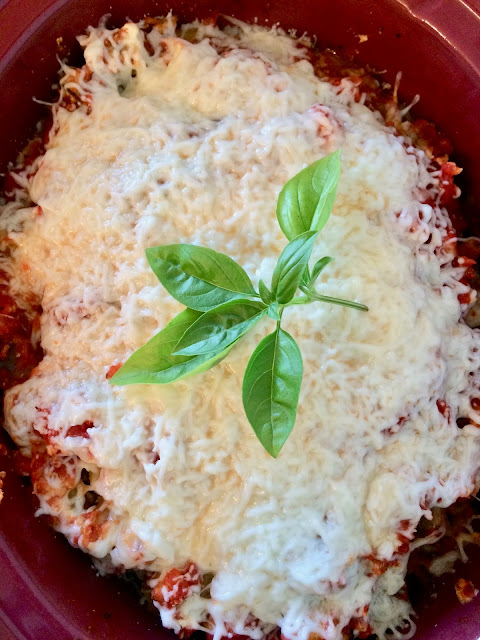 Top view of the eggplant baked ziti with cheese melted on top.