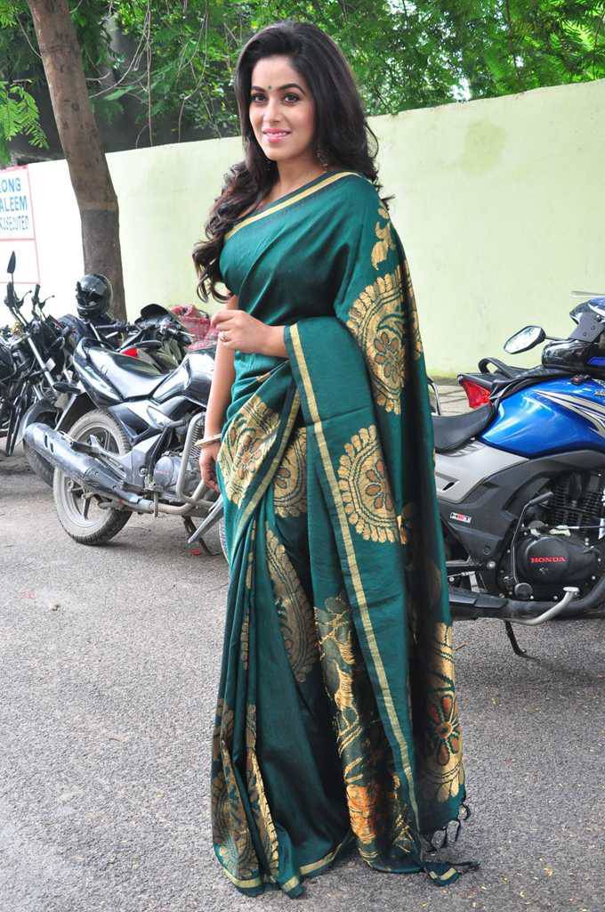 Tollywood Actress Poorna Stills In Green Saree At Fashion Studio Launch