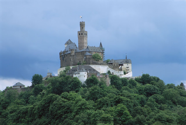 The formidable 700-year-old Marksburg Castle rises above the town of Braubach where the Mosel meets the Rhine. Photo: © German National Tourist Office. Unauthorized use is prohibited. 