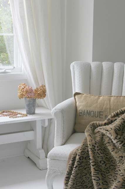 Cozy fall vignette with neutrals in serene room by Hello Lovely Studio