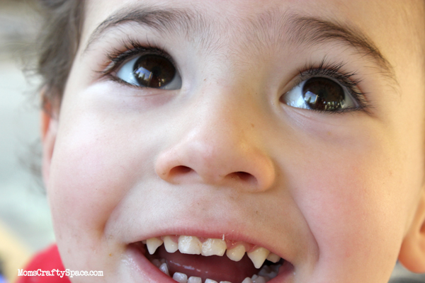 kids watching butterfly being released