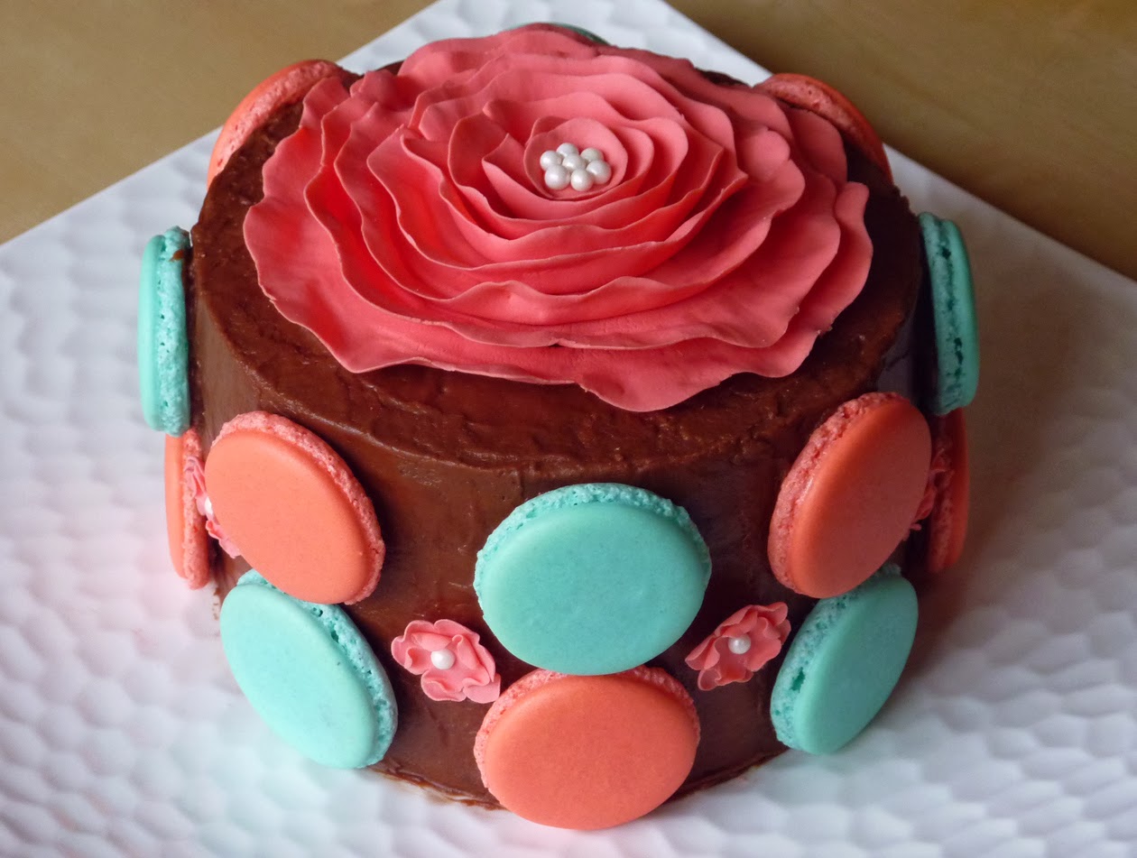 Chocolate cake with peppermint buttercream filling, fudge frosting and macaron shells