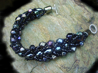 Handmade beaded bracelet from black glass beads made by Gunadesign